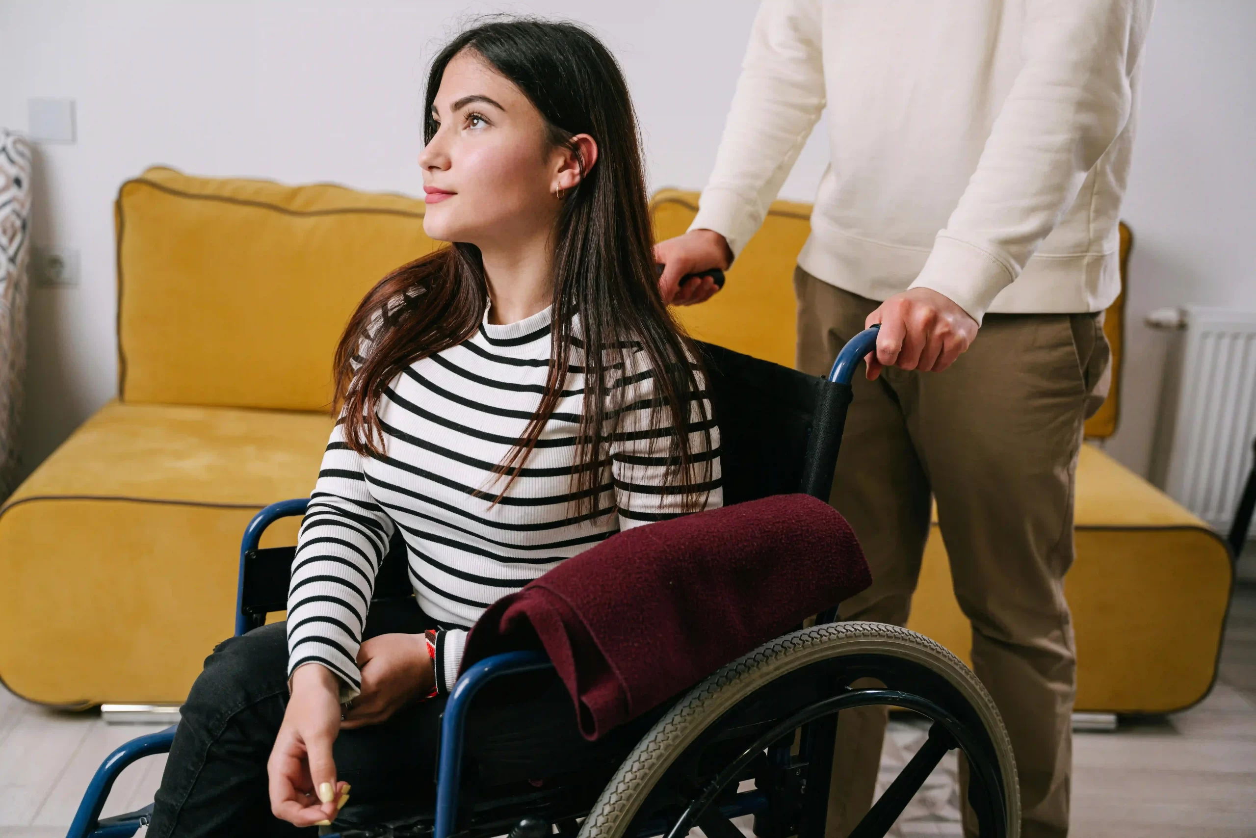NDIS support worker providing in-home care assistance in Fairfield home