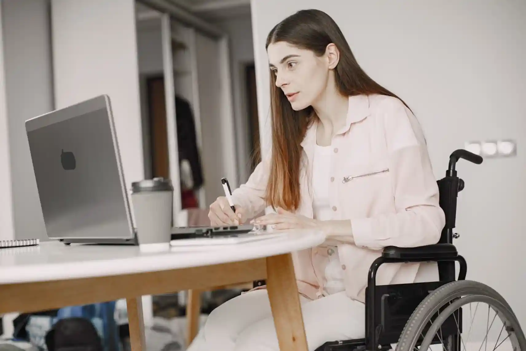 A person reviewing paperwork and evidence to appeal a rejected NDIS application