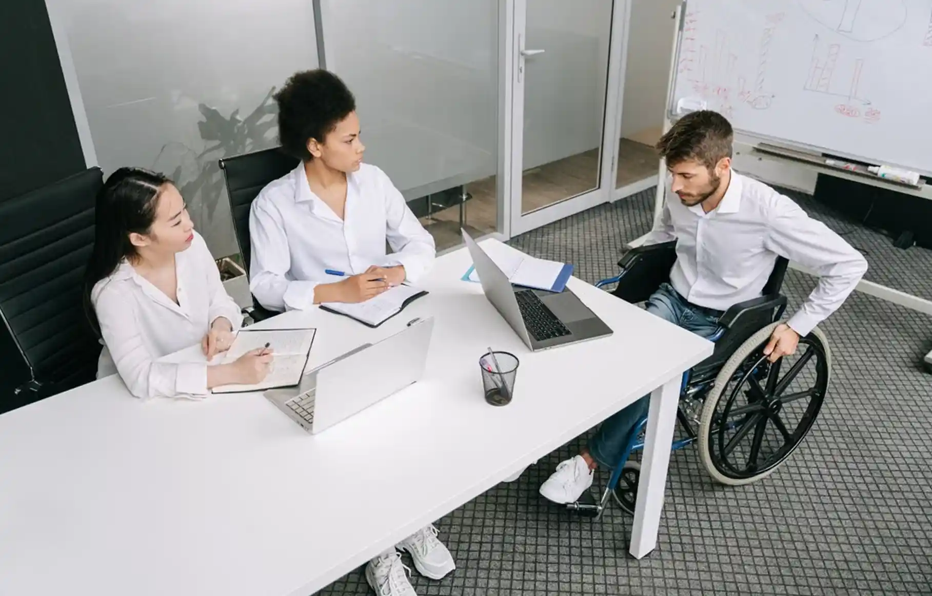 A participant and planner having a conversation during an NDIS planning meeting