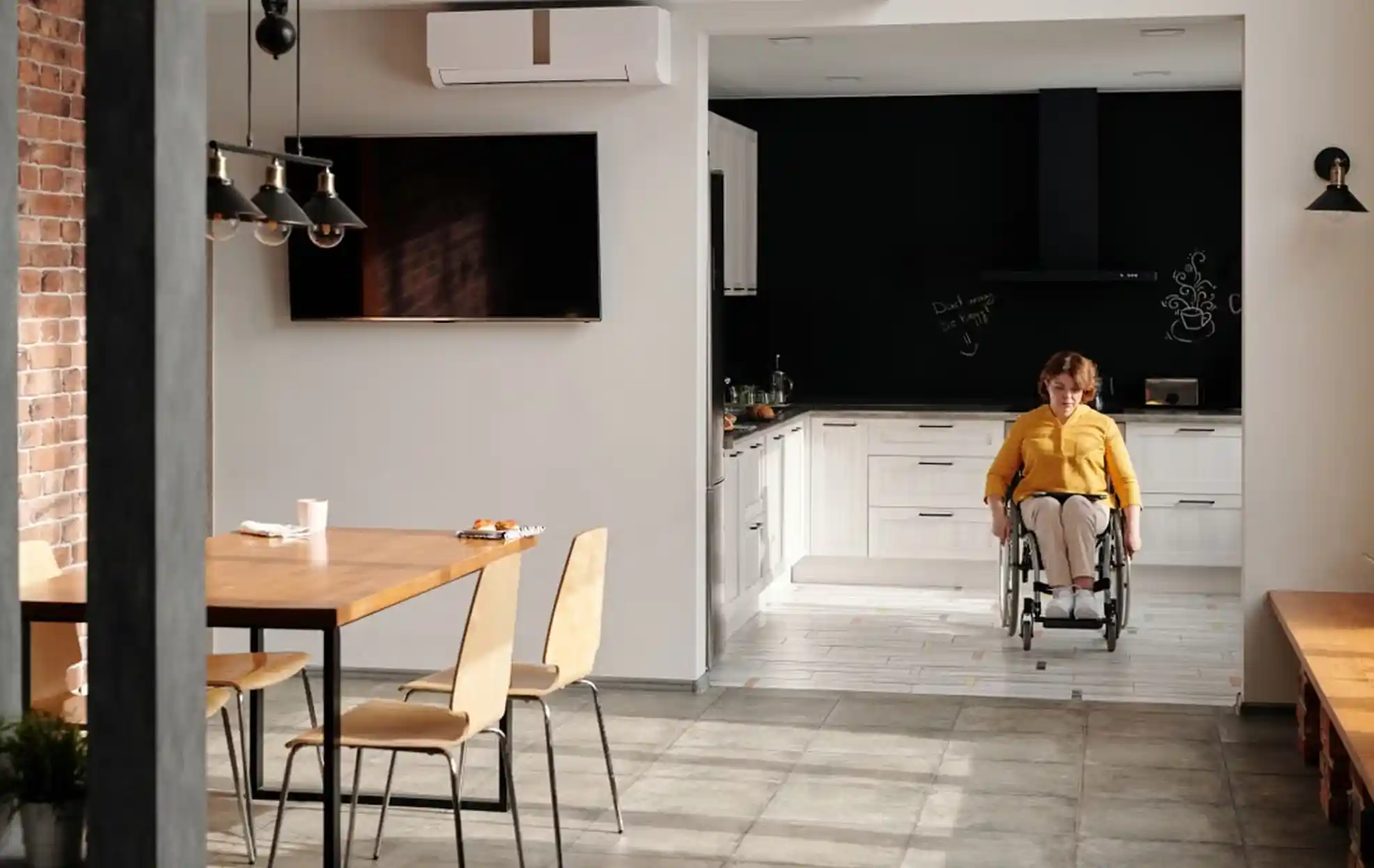A support worker assisting a participant with daily tasks in a supported independent living home